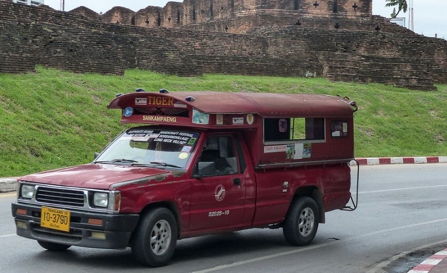 Songthaew, a traditional shared truck used for local travel in Thailand.