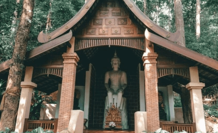 Lanna wooden temple with a Buddha statue