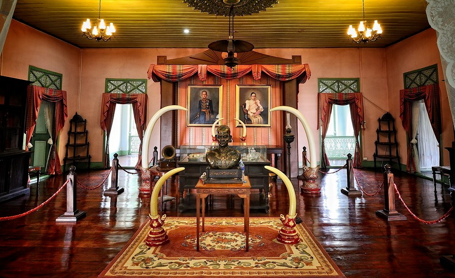 Historical artifacts displayed inside Khum Chao Luang, Phrae